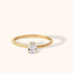 14K gold ring with pear-shaped solitaire diamond on minimalist band