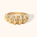 14K gold dome ring with sculpted swirl design and pavé diamond accents