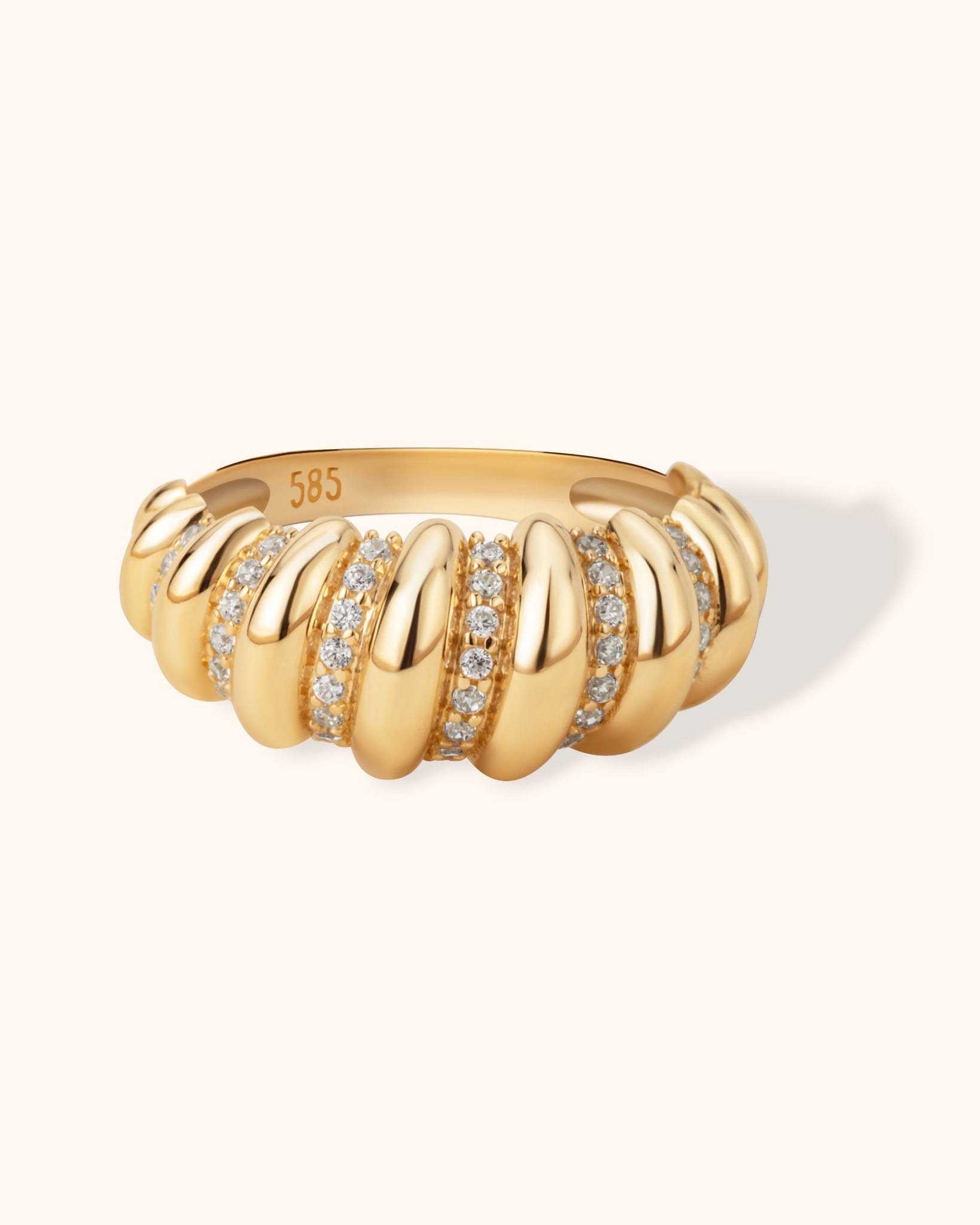 14K gold dome ring with sculpted swirl design and pavé diamond accents