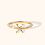14K gold ring with marquise-cut center and baguette zirconia in a starburst design