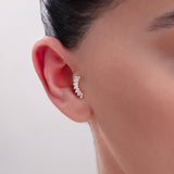 Model wearing a 14K Gold Baguette CZ Ear Crawler Stud – Statement cartilage earring with a curved row of rectangular cubic zirconia stones, ideal for helix or conch placements with a modern cuff illusion.
