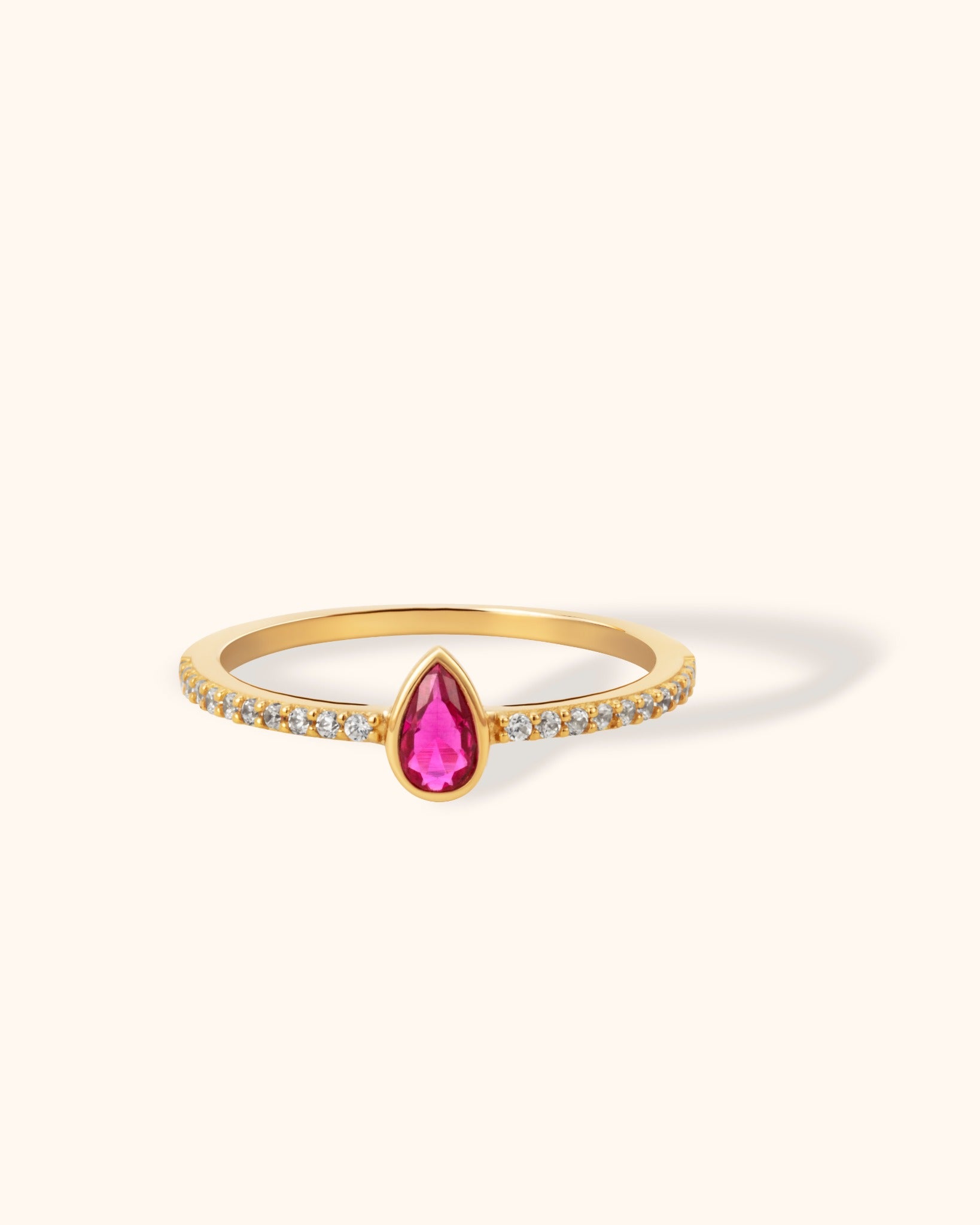 14K gold ring with pink teardrop gemstone and pavé-set band, elegant and colorful fine jewelry