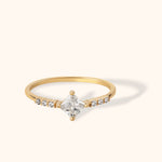 14K gold ring with princess-cut center stone and diamond accents