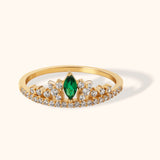 14K gold tiara-style ring with marquise emerald center and pavé diamonds