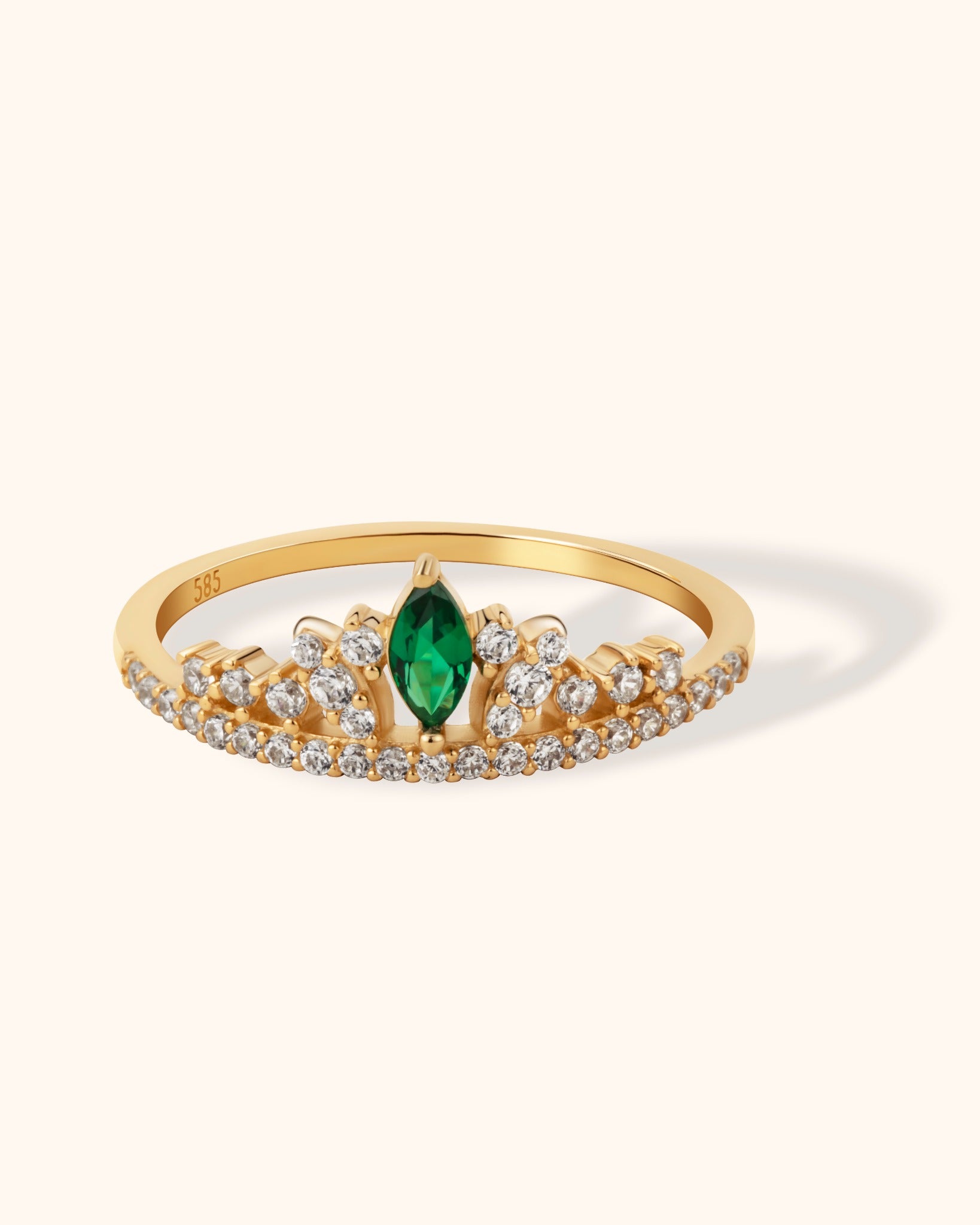 14K gold tiara-style ring with marquise emerald center and pavé diamonds