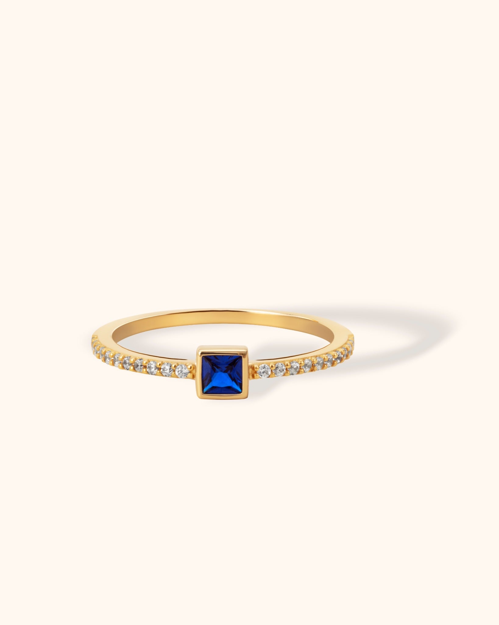 14K gold ring with square-cut royal blue sapphire and pavé white zirconia accents