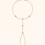 Gold floral hand chain bracelet with finger loop and delicate flower charms