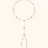 Gold floral hand chain bracelet with finger loop and delicate flower charms