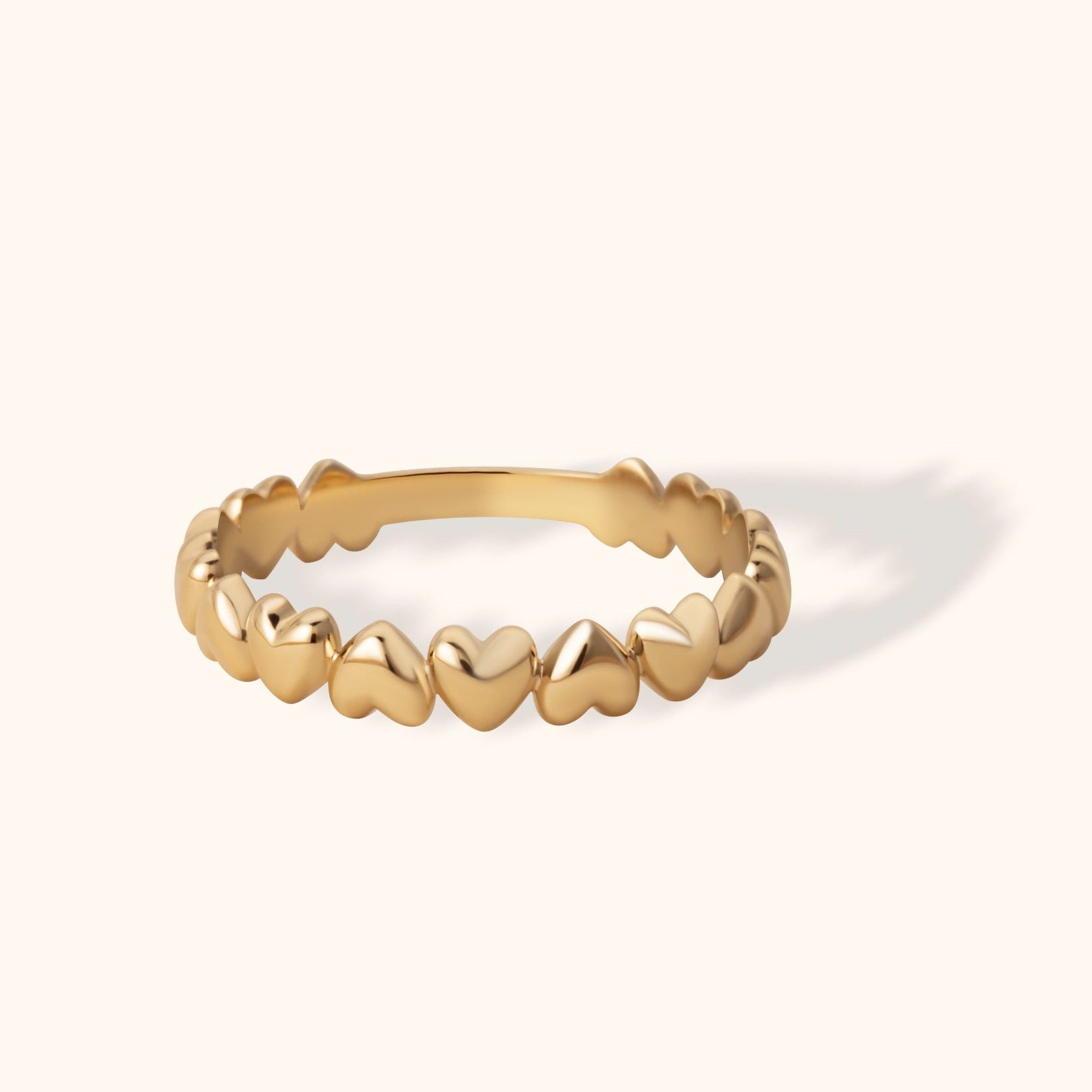 14K gold ring with dainty heart-shaped links all around the band