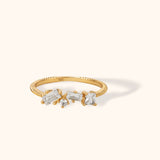 14K gold ring with mixed-cut diamonds on a textured gold band