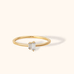 14K gold ring with two vertical baguette-cut diamonds in a minimalist open design