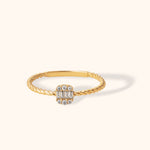 14K gold ring with twisted band and rectangular baguette and round zirconia cluster