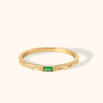 Minimal 14K gold ring with engraved band and rectangular emerald baguette