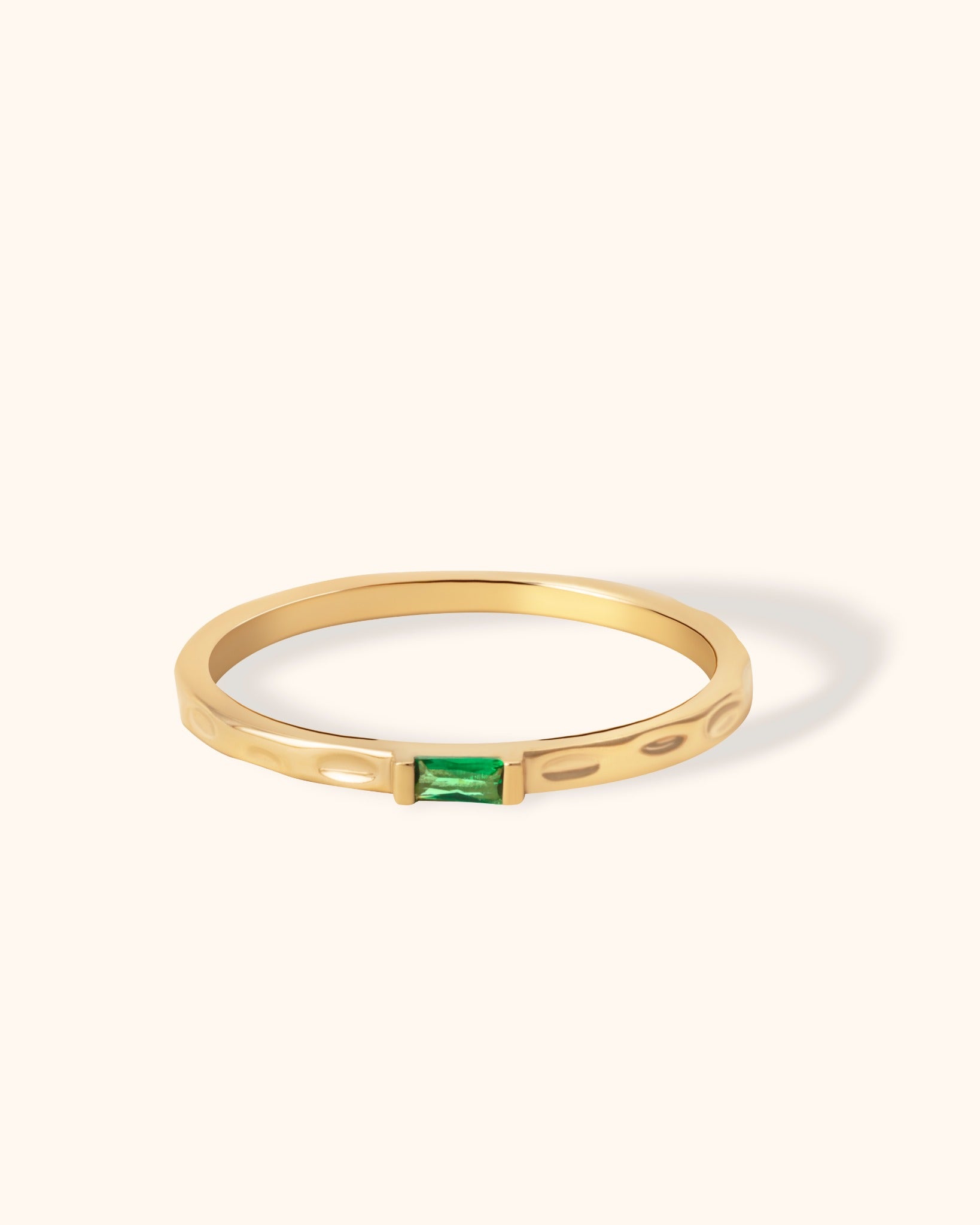 Minimal 14K gold ring with engraved band and rectangular emerald baguette