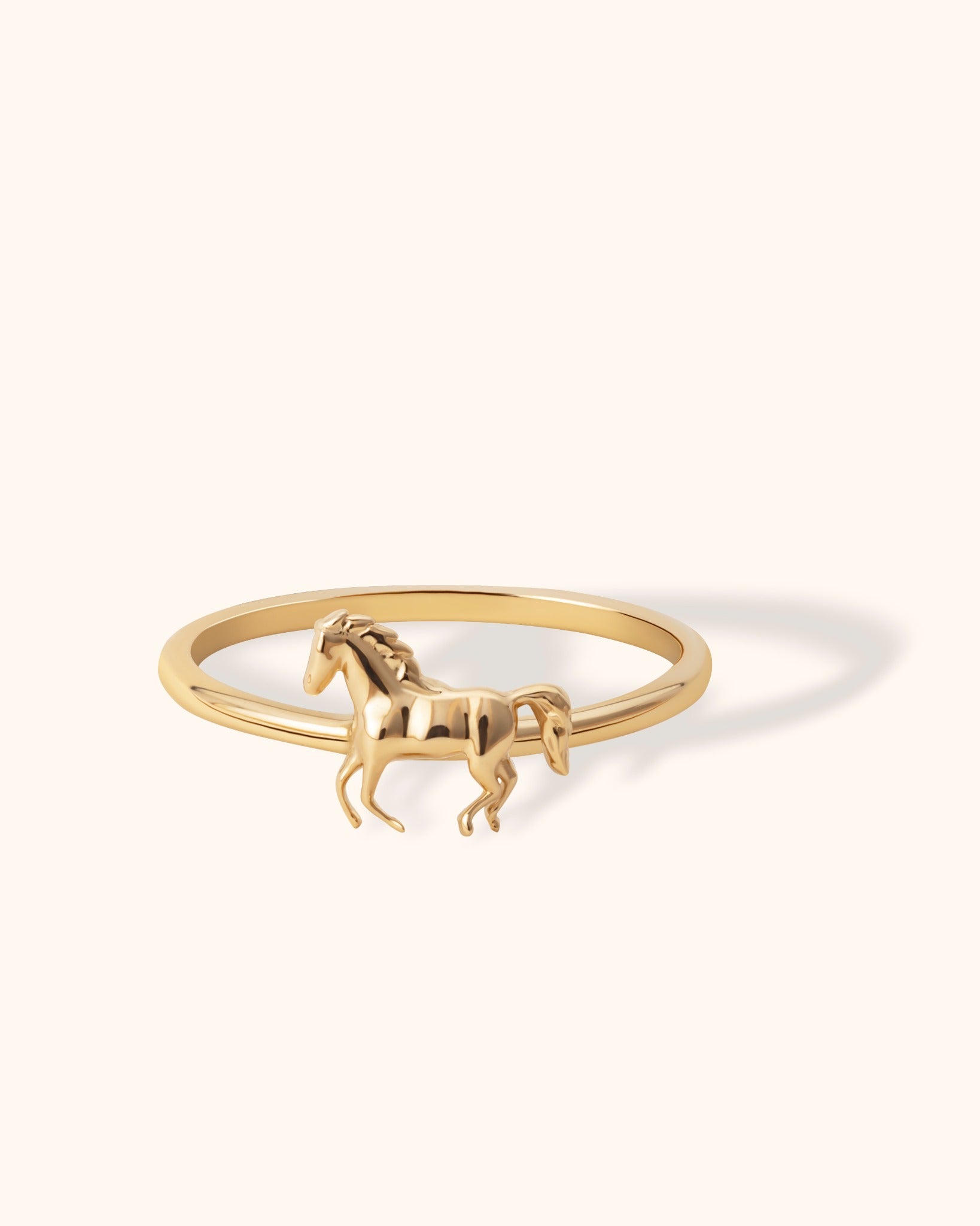 Minimalist 14K gold ring with running horse motif for equestrian jewelry lovers