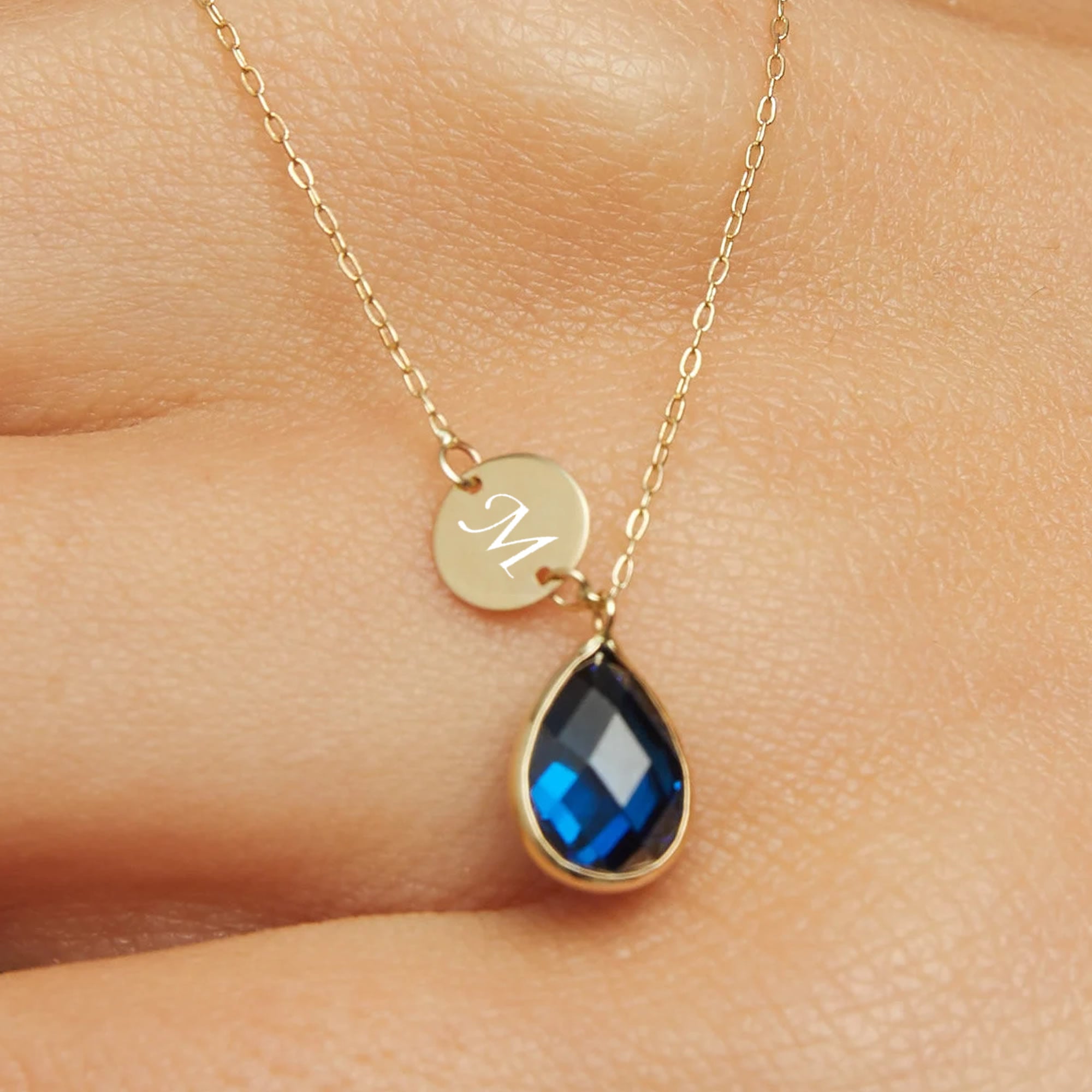 14K gold necklace with teardrop blue sapphire and round gold initial disc charm