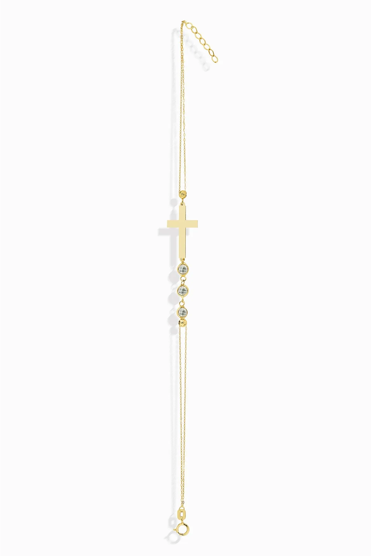 14K gold bracelet with minimalist cross and three small crystal beads, displayed white