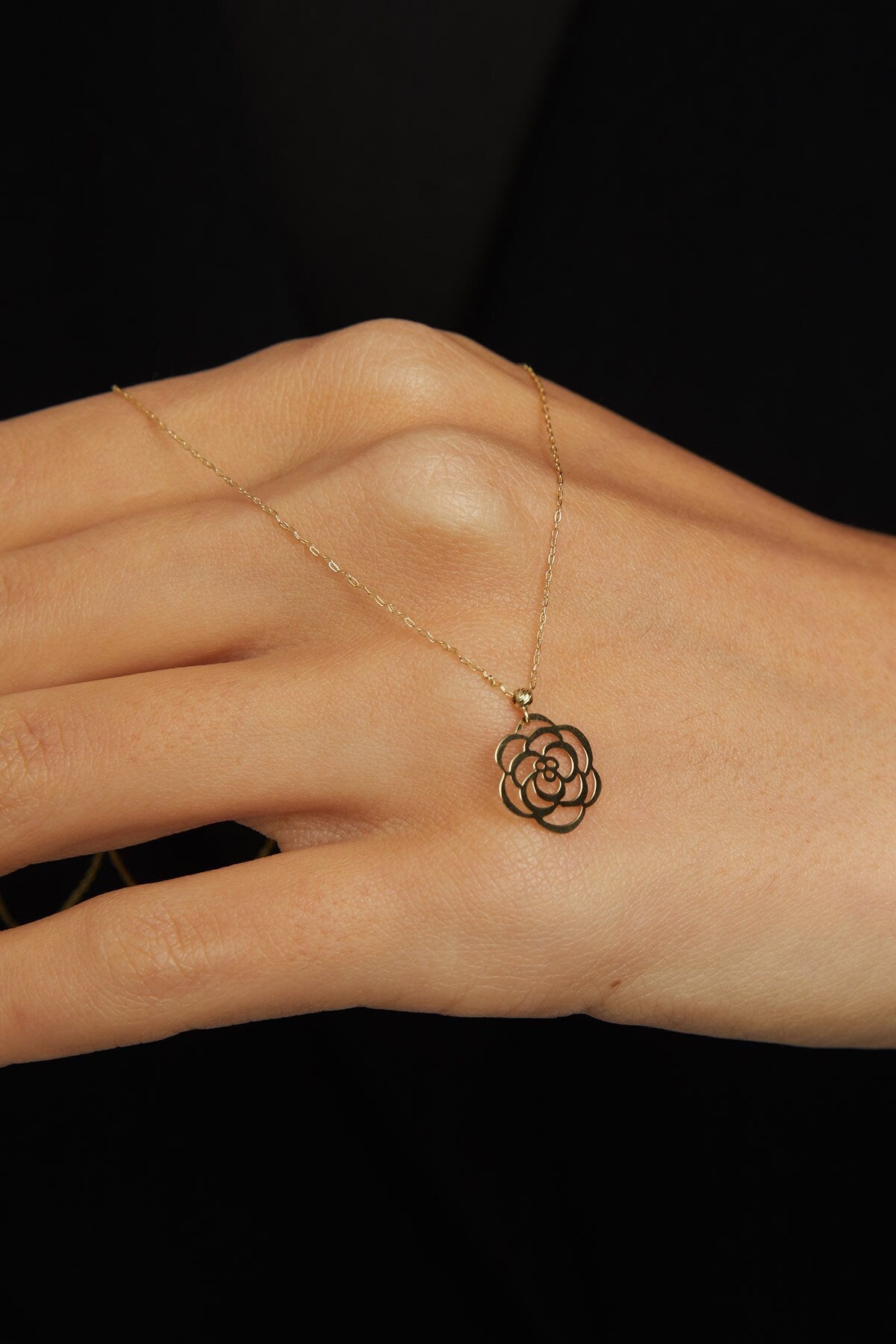 Real 14K gold rose-shaped flower pendant necklace symbolizing elegance and love.