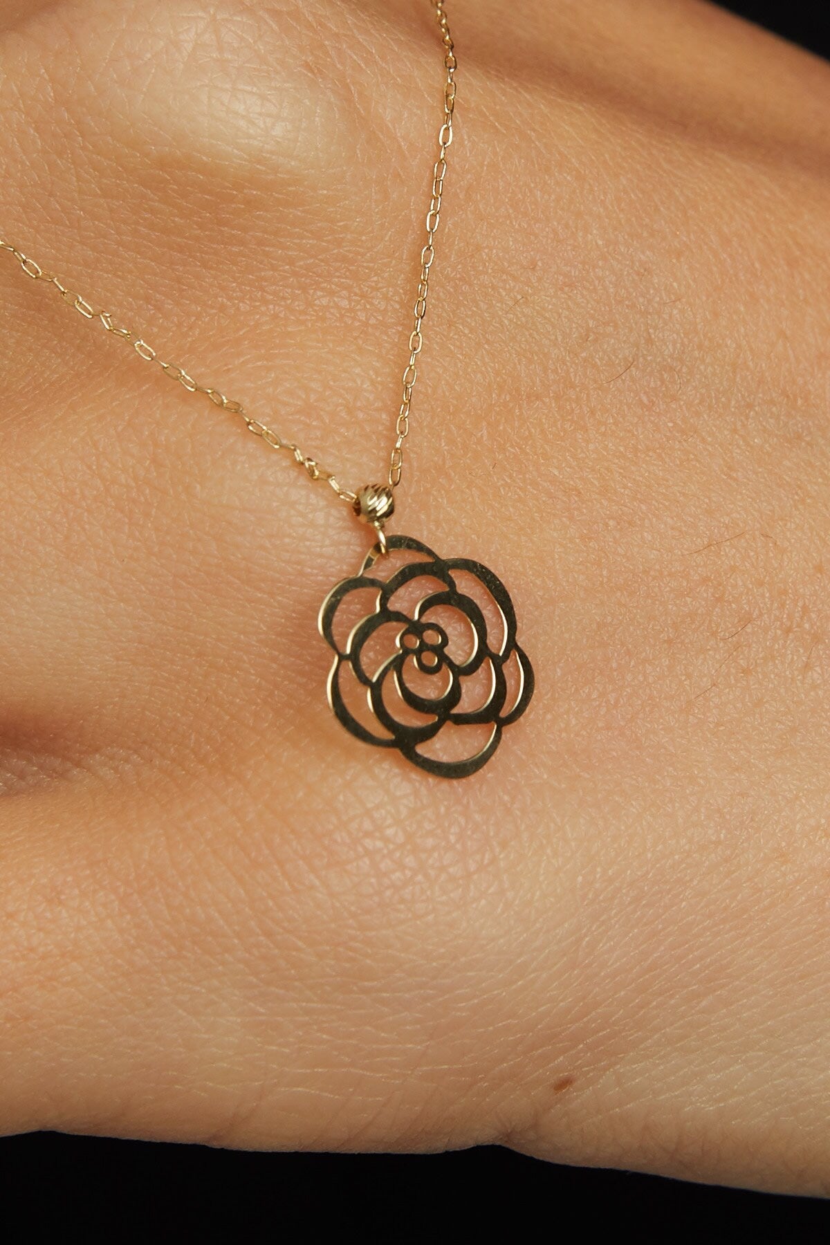 Real 14K gold rose-shaped flower pendant necklace symbolizing elegance and love.