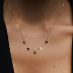 14K gold necklace with multiple clover charm discs