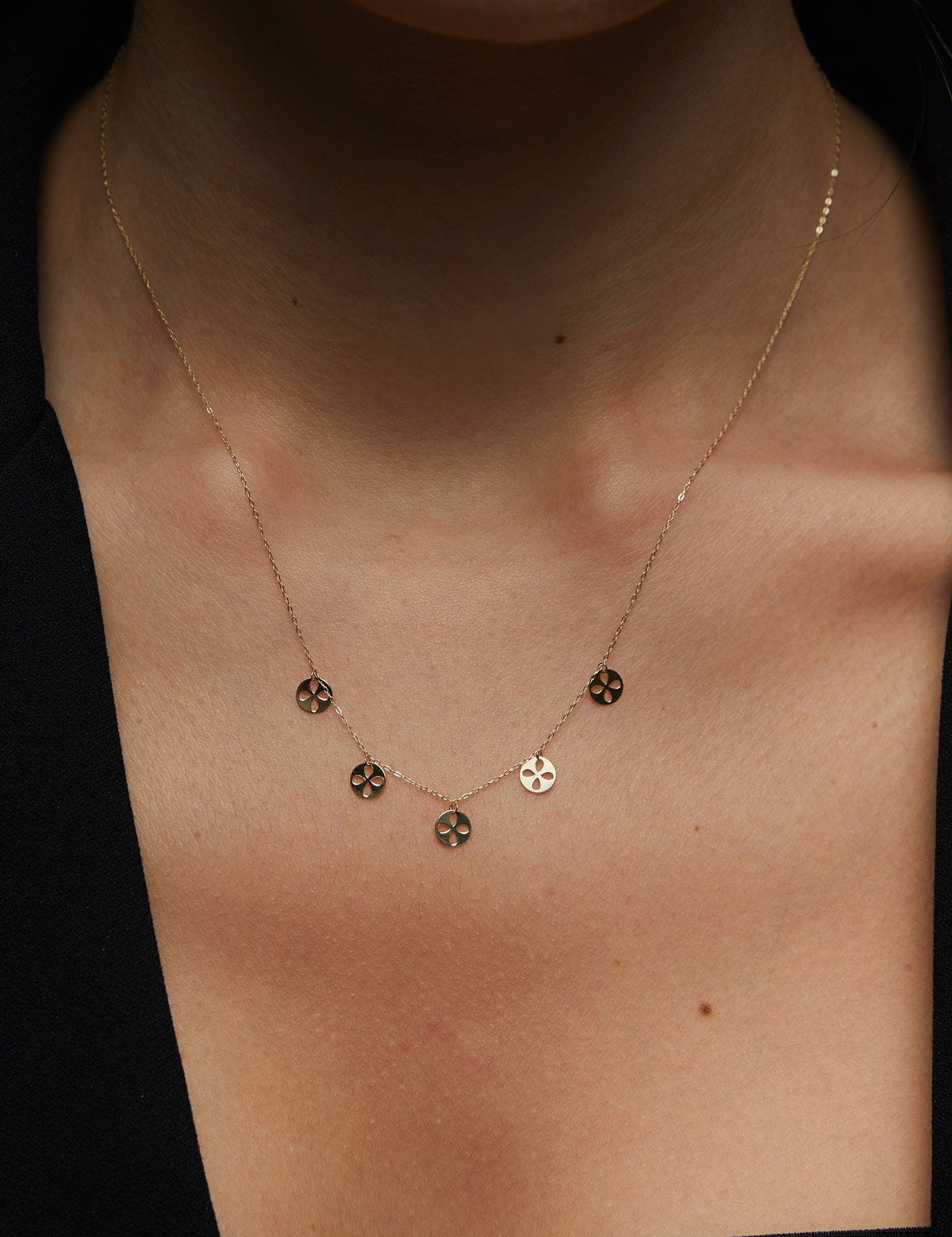 14K gold necklace with multiple clover charm discs