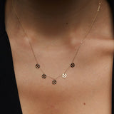 14K gold necklace with multiple clover charm discs
