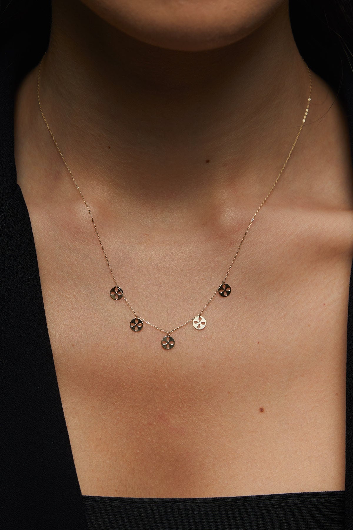 14K gold necklace with multiple clover charm discs