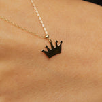 14K gold necklace with a polished crown-shaped pendant