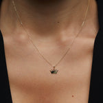 14K gold necklace with a polished crown-shaped pendant