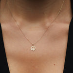 14K solid gold four-leaf clover necklace, symbolizing luck and elegance
