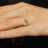 14K solid gold necklace featuring a delicate seashell pendant