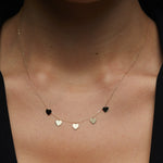 Multiple heart charm necklace in 14K gold