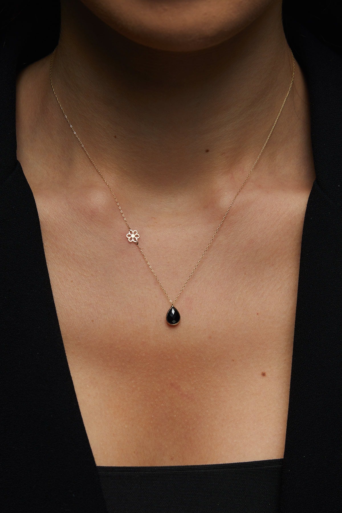 Elegant 14K gold necklace with black onyx teardrop pendant