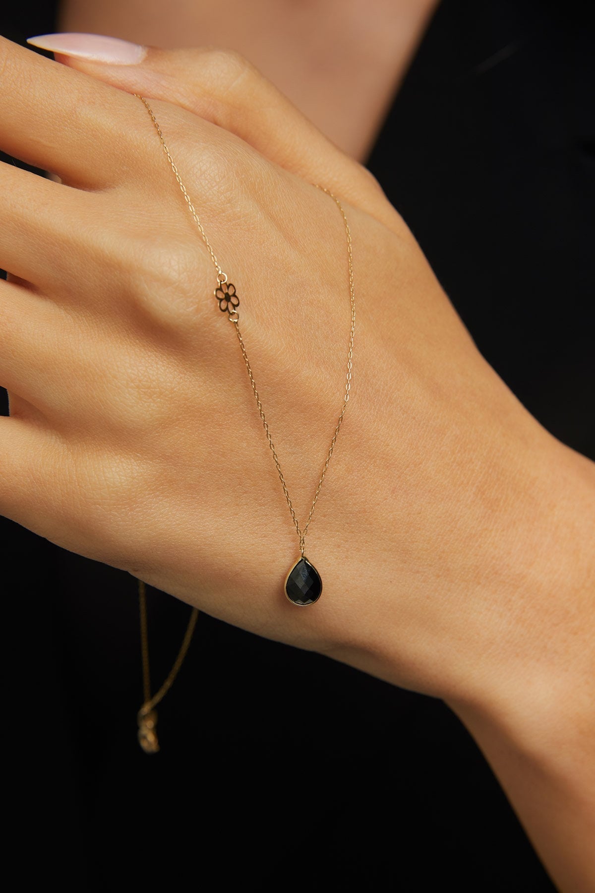 Elegant 14K gold necklace with black onyx teardrop pendant