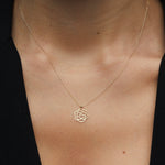 Real 14K gold rose-shaped flower pendant necklace symbolizing elegance and love.