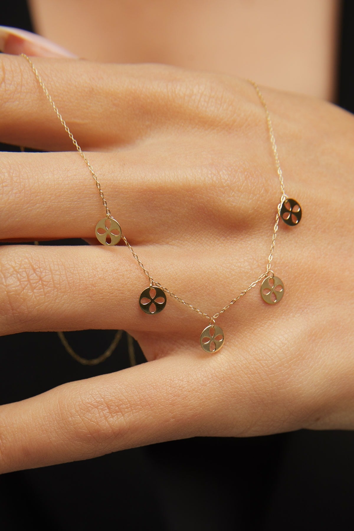 14K gold necklace with multiple clover charm discs
