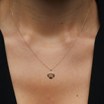 14K solid gold necklace featuring a delicate seashell pendant