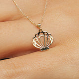 14K solid gold necklace featuring a delicate seashell pendant