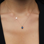 14K gold necklace with teardrop blue sapphire and round gold initial disc charm