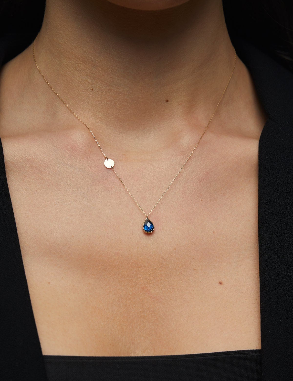 14K gold necklace with teardrop blue sapphire and round gold initial disc charm