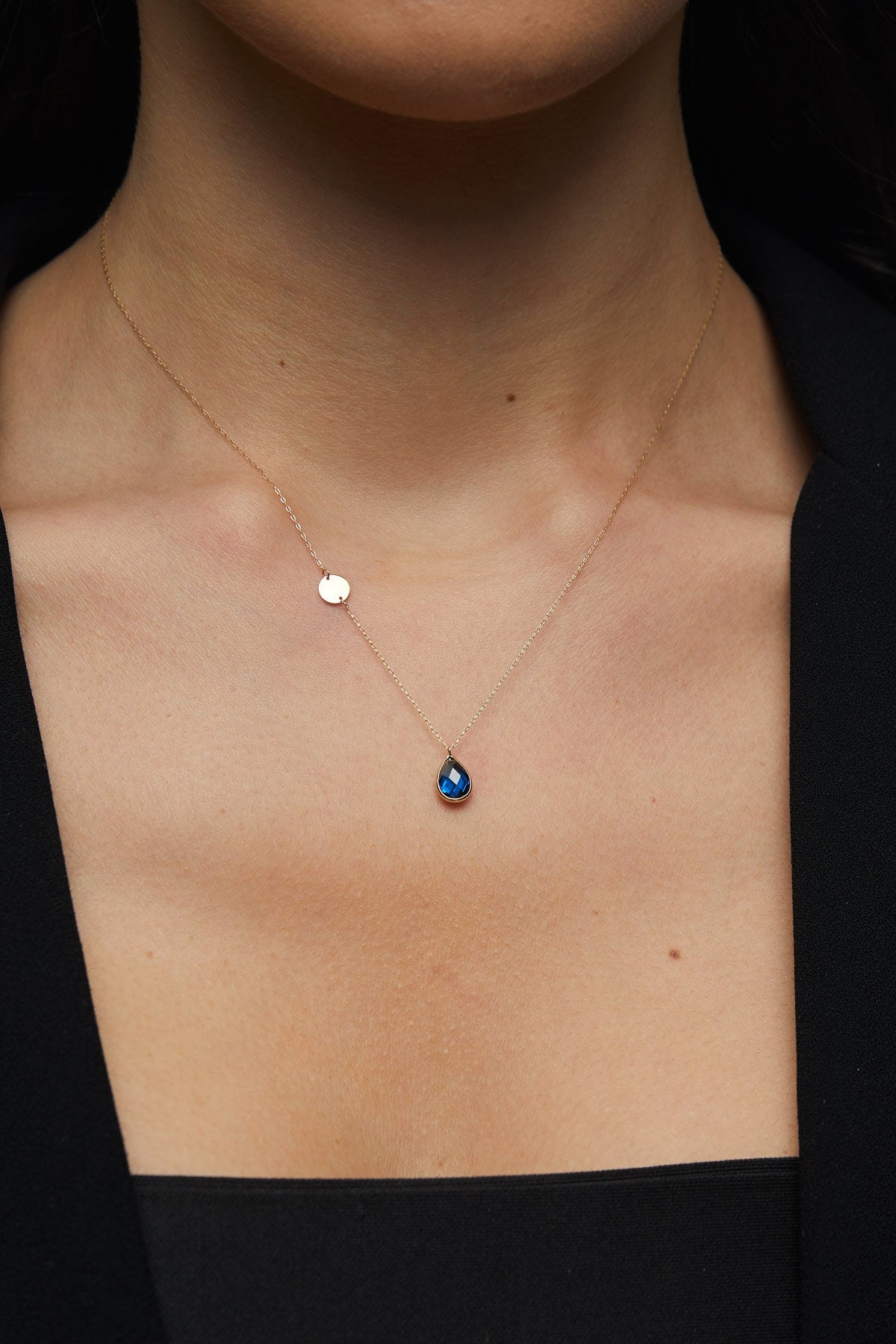 14K gold necklace with teardrop blue sapphire and round gold initial disc charm
