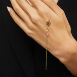 Elegant 14K gold bracelet featuring a snowflake charm and crystal bead accents