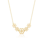 14K gold necklace with five small open flower charms displayed – elegant and minimalist.
