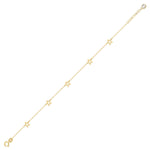 14K gold bracelet with delicate open star charms on green fabric