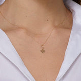 14K gold four leaf clover necklace with circular loop detail, – elegant and symbolic.