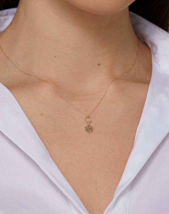 14K gold four leaf clover necklace with circular loop detail, – elegant and symbolic.