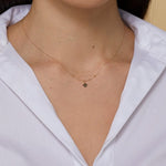 Minimal 14K gold clover charm necklace with polished gold beads,