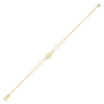 14K gold bracelet with central leaf charm, styled