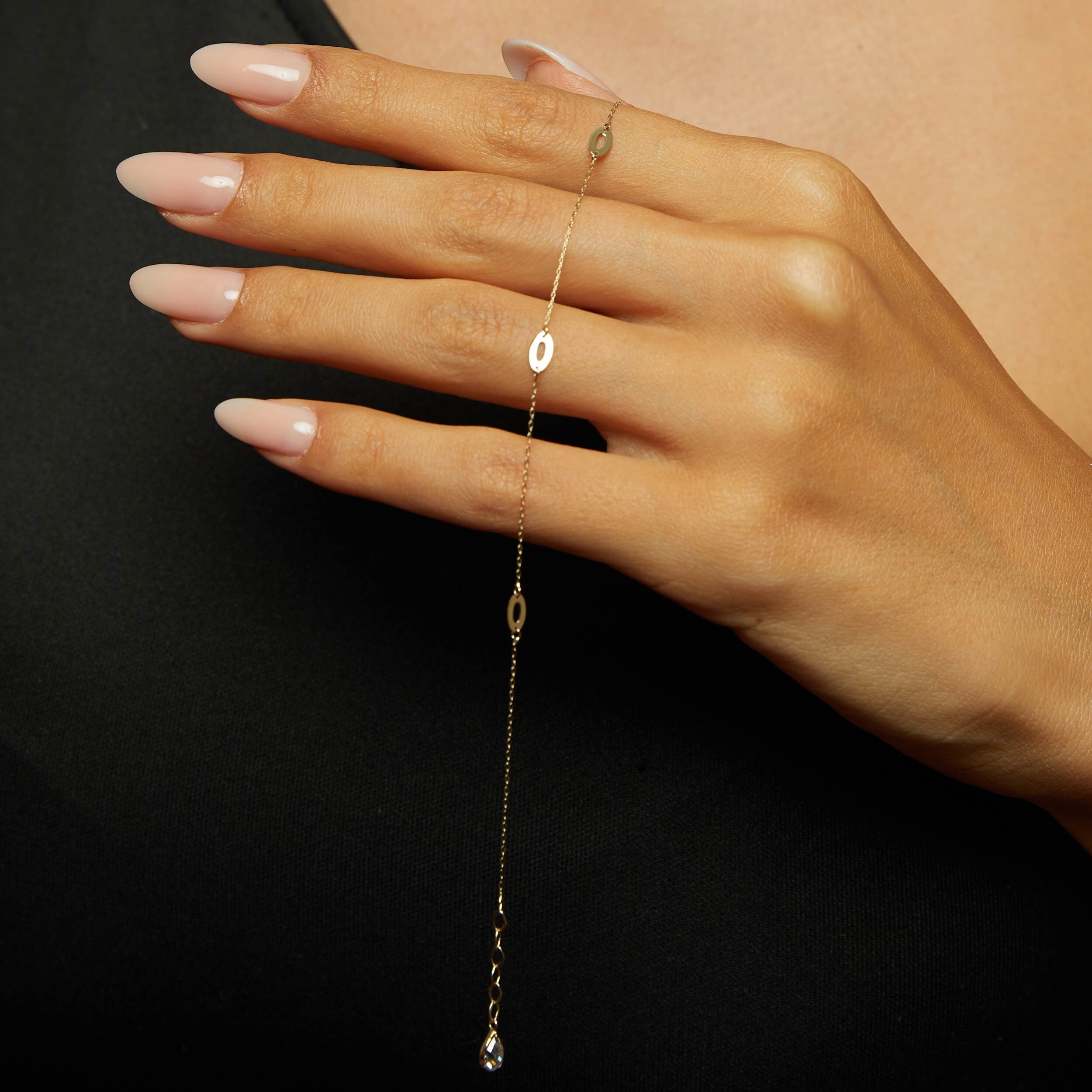 14K gold bracelet with elongated marquise-shaped link elements,