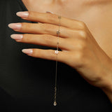 Close-up of a 14K gold bracelet with hollow star charms and gold beads